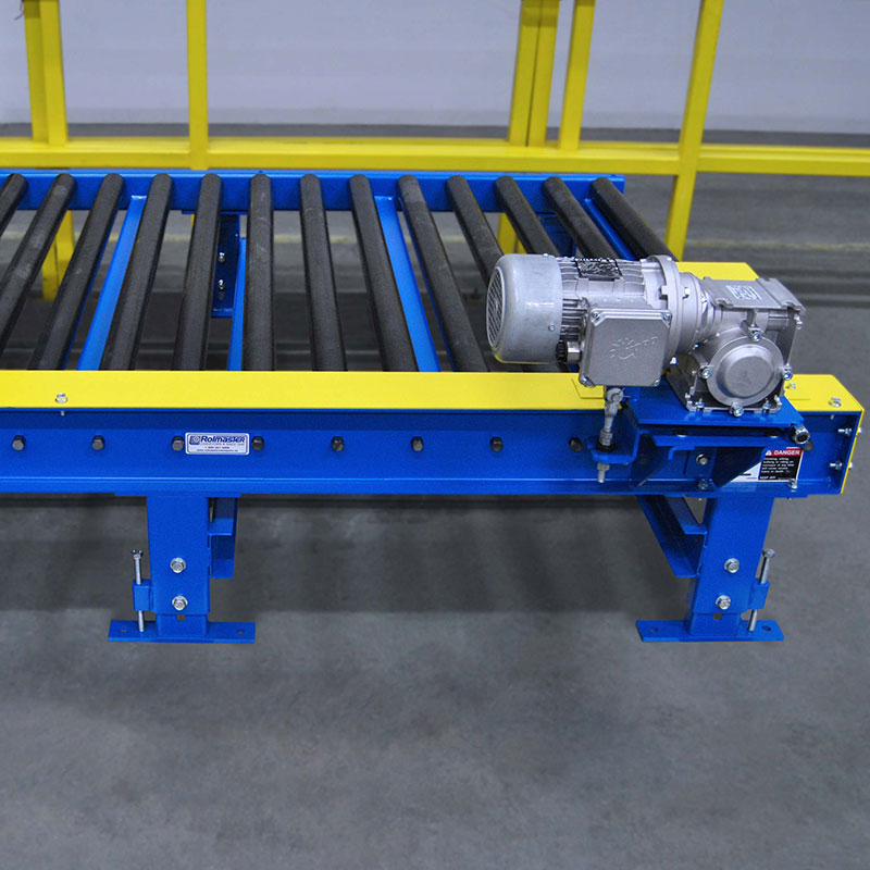 Driven conveyor outlet rollers