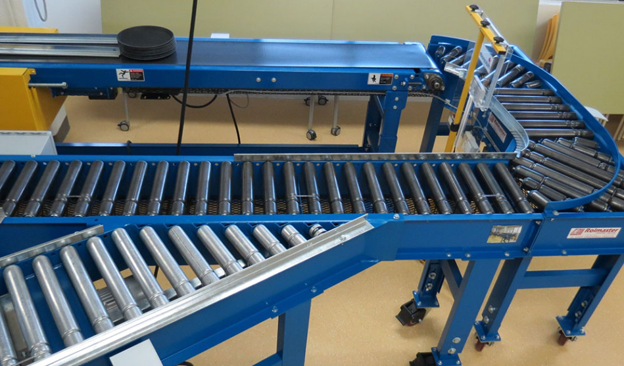 Conveyor showing a combined design of merge, curve, lineshaft, and belt all in a single system. This truly showcases the conveyor manufacturer experience that goes into creating complex configurations.
